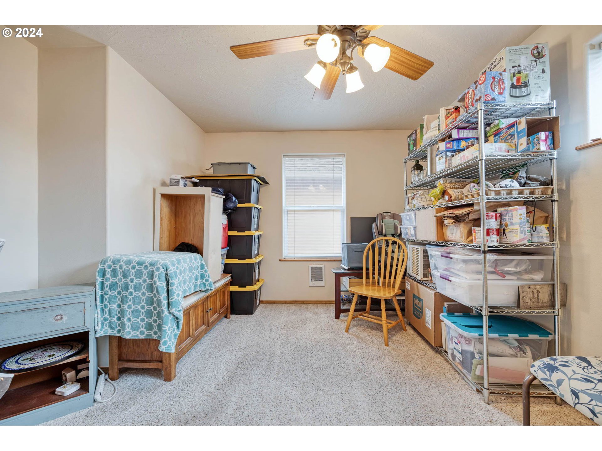 4850 A Street Springfield, OR 97478 - Photo 32 of 40 a bedroom with furniture and a chandelier