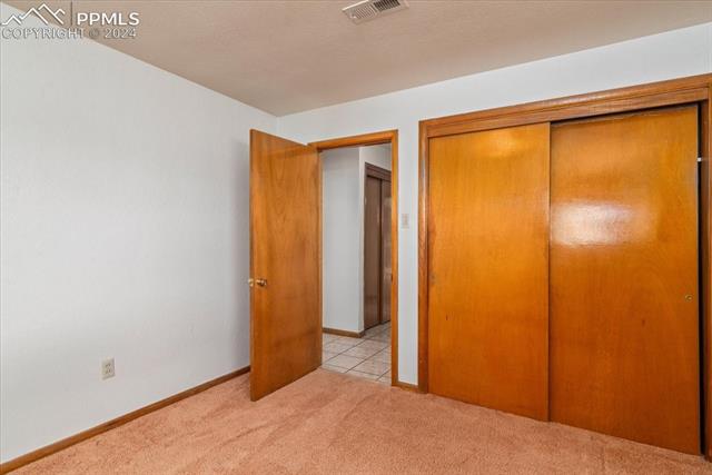28018 County Farm Road Pueblo, CO 81006 - Photo 10 of 50 Unfurnished bedroom featuring light colored carpet and a closet