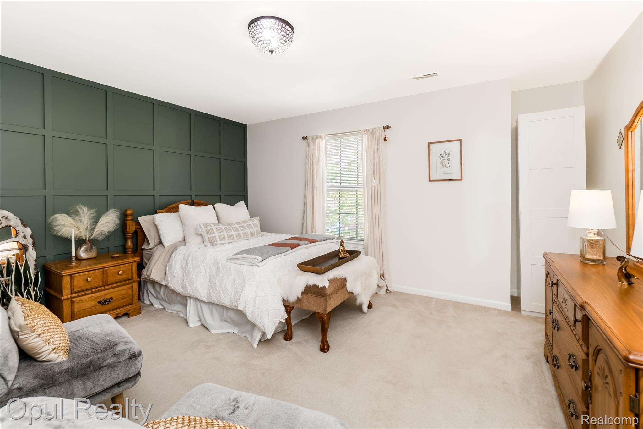 11762 Farmington Road Livonia, MI 48150 - Photo 12 of 25 Bedroom with a decorative wall, light carpet, and an accent wall