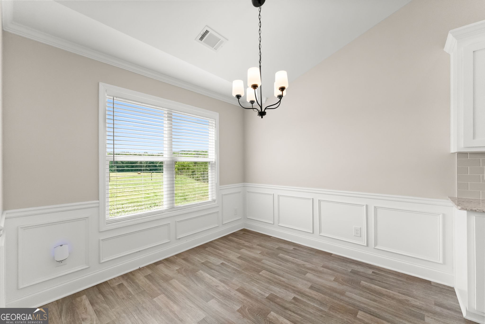 810 Anderson Thomas Road Martin, GA 30557 - Photo 10 of 40 a view of an empty room with a window and wooden floor