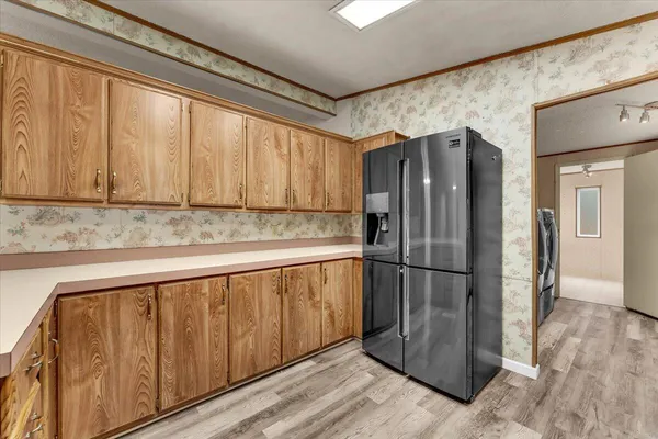 a kitchen with granite countertop a stove and a sink