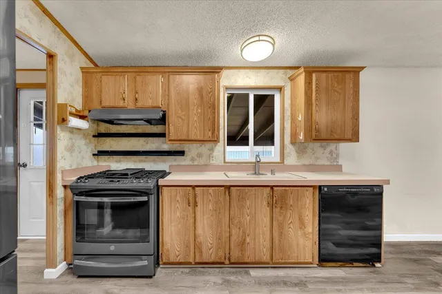 a view of a hallway with washer and dryer