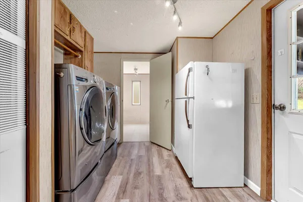 a view of a livingroom with a ceiling fan and window