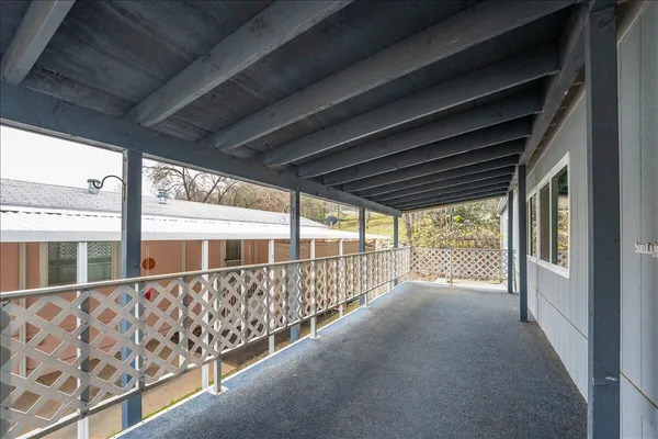 a view of an empty room with windows