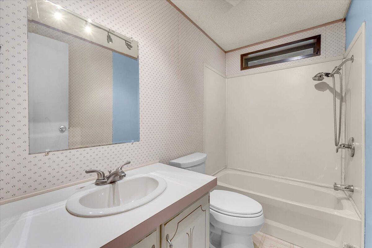 1237 Mountain Shadows Boulevard Redding, CA 96003 - Photo 23 of 34 a bathroom with a sink toilet and shower
