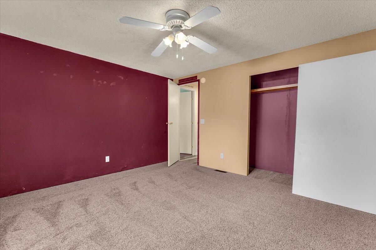 1237 Mountain Shadows Boulevard Redding, CA 96003 - Photo 25 of 34 a view of a big room with a ceiling fan and a chandelier fan