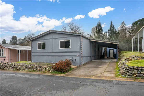 a view of a house with a yard