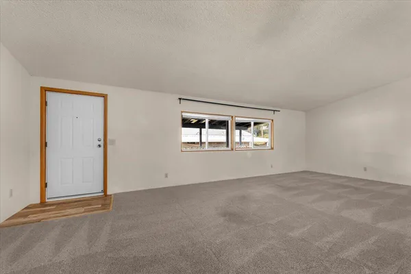 a view of a big room with wooden cabinet and a fireplace