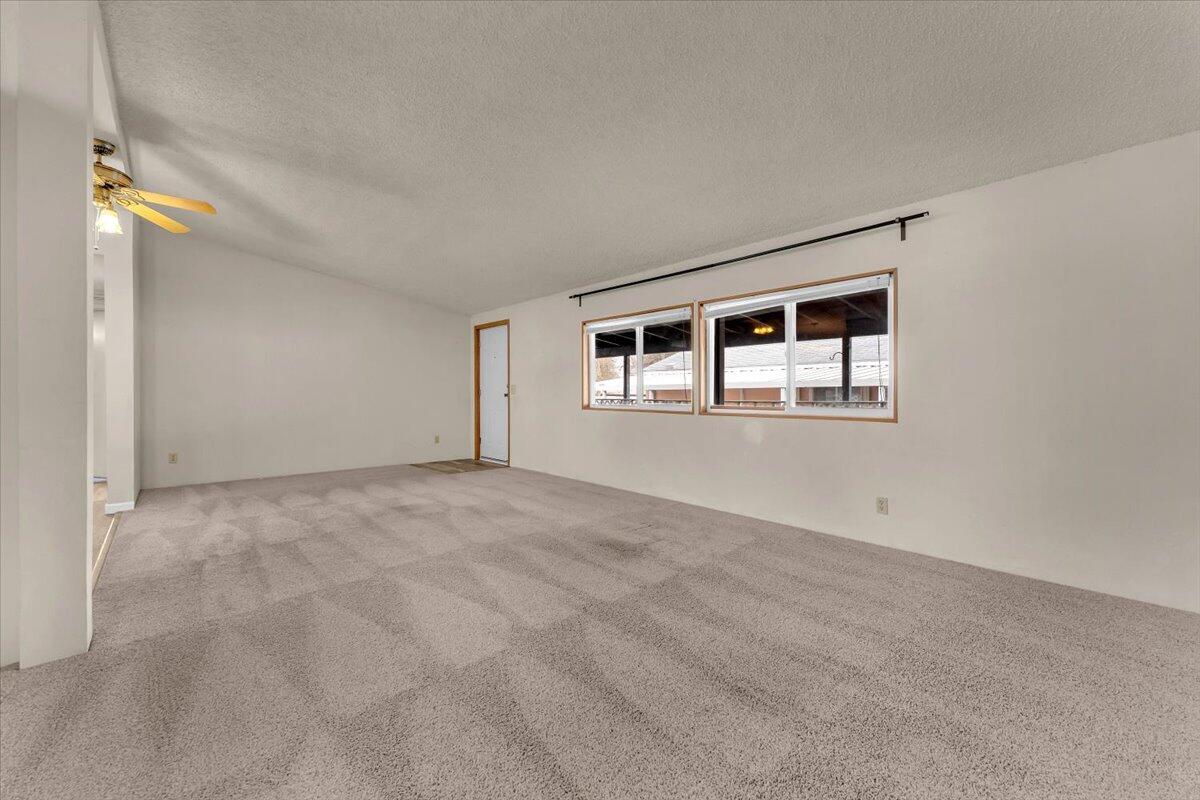 1237 Mountain Shadows Boulevard Redding, CA 96003 - Photo 8 of 34 a view of empty room with windows