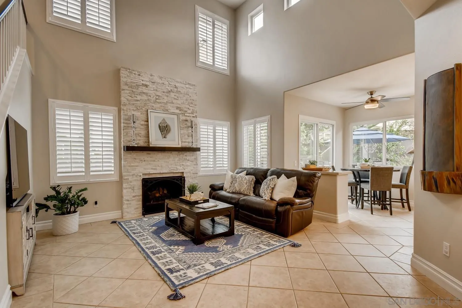 11468 Village Ridge Road San Diego, CA 92131 - Photo 12 of 28 a living room with furniture and a fireplace