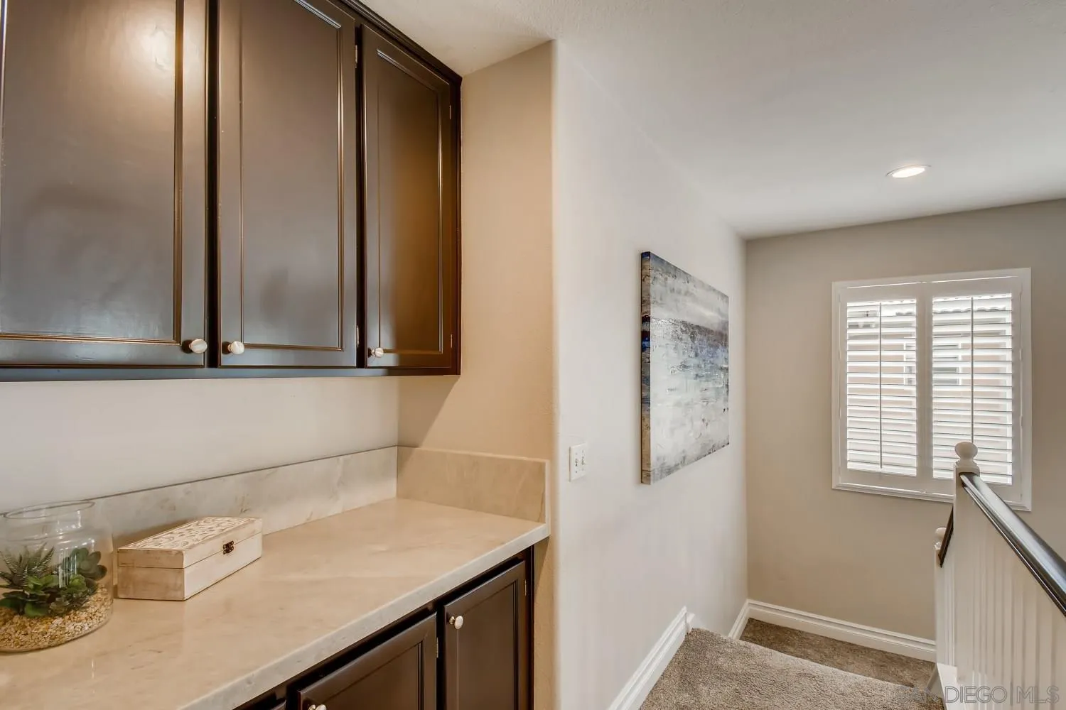 11468 Village Ridge Road San Diego, CA 92131 - Photo 22 of 28 a bathroom with a sink and a mirror