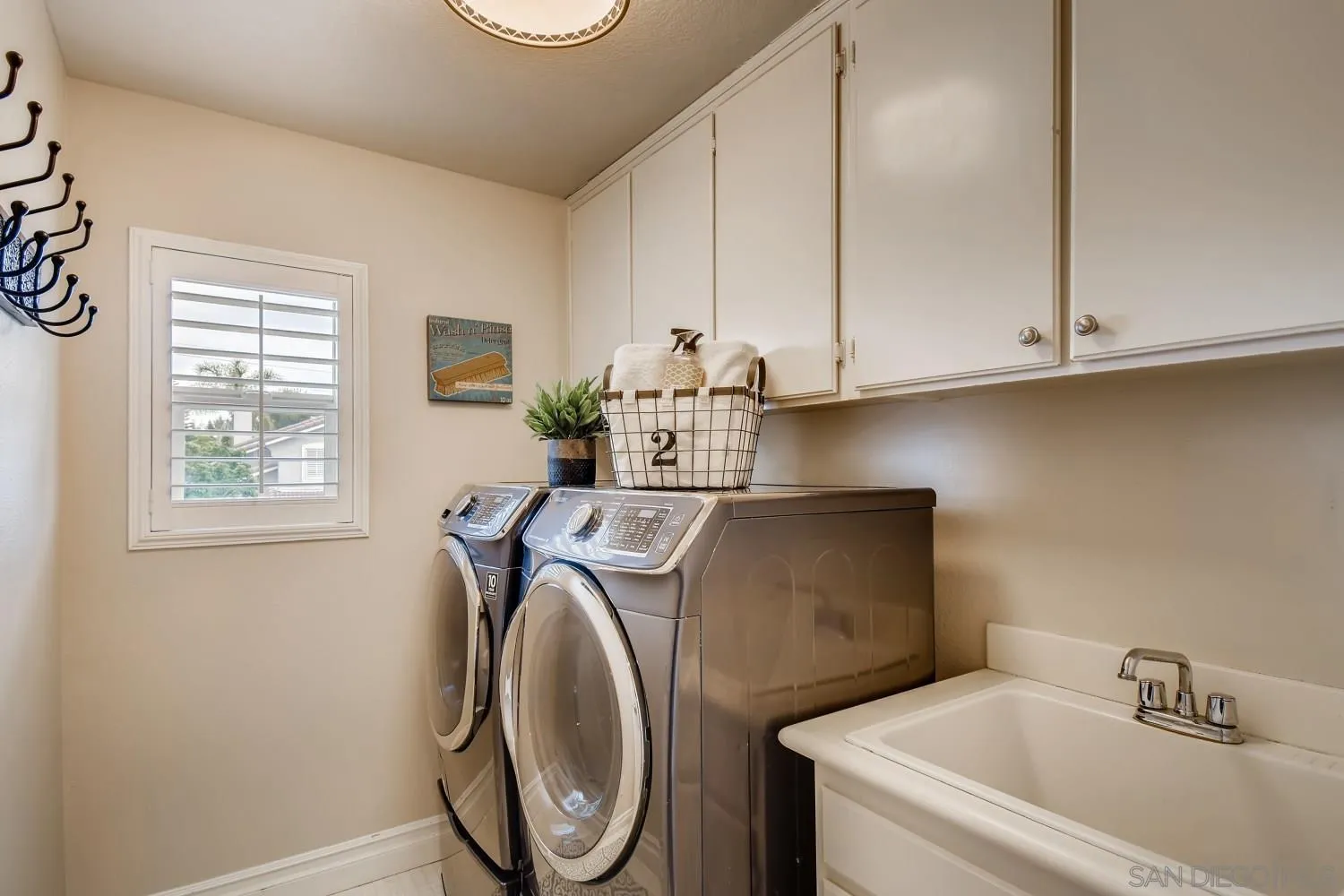 11468 Village Ridge Road San Diego, CA 92131 - Photo 23 of 28 a utility room with dryer and washer