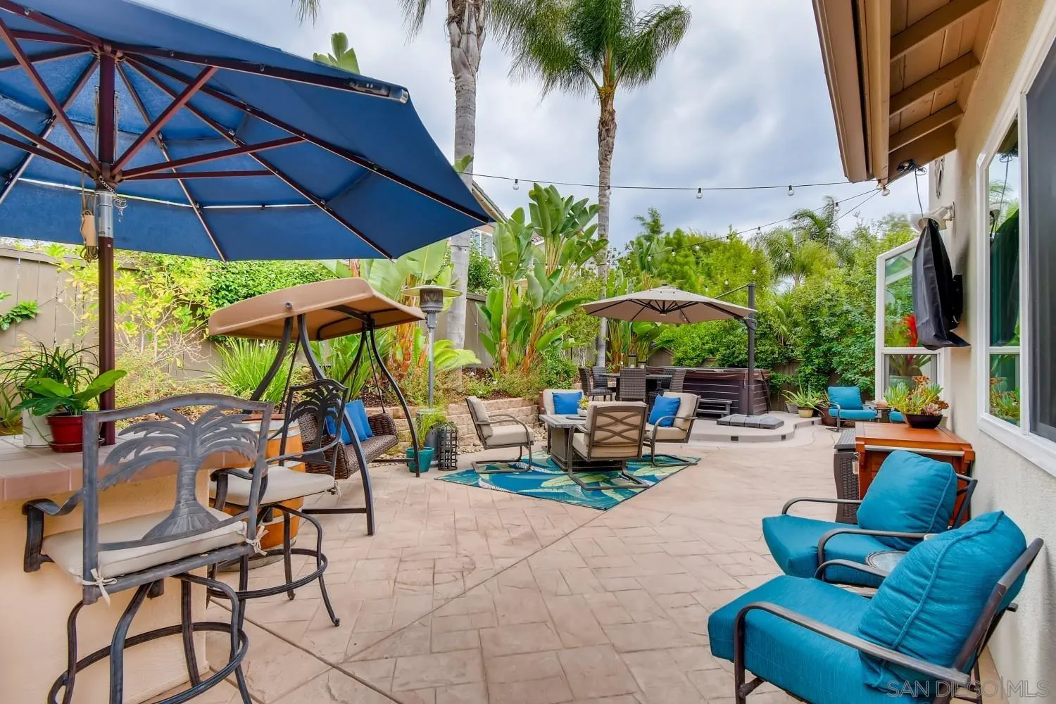 11468 Village Ridge Road San Diego, CA 92131 - Photo 24 of 28 a view of a chairs and table in the patio