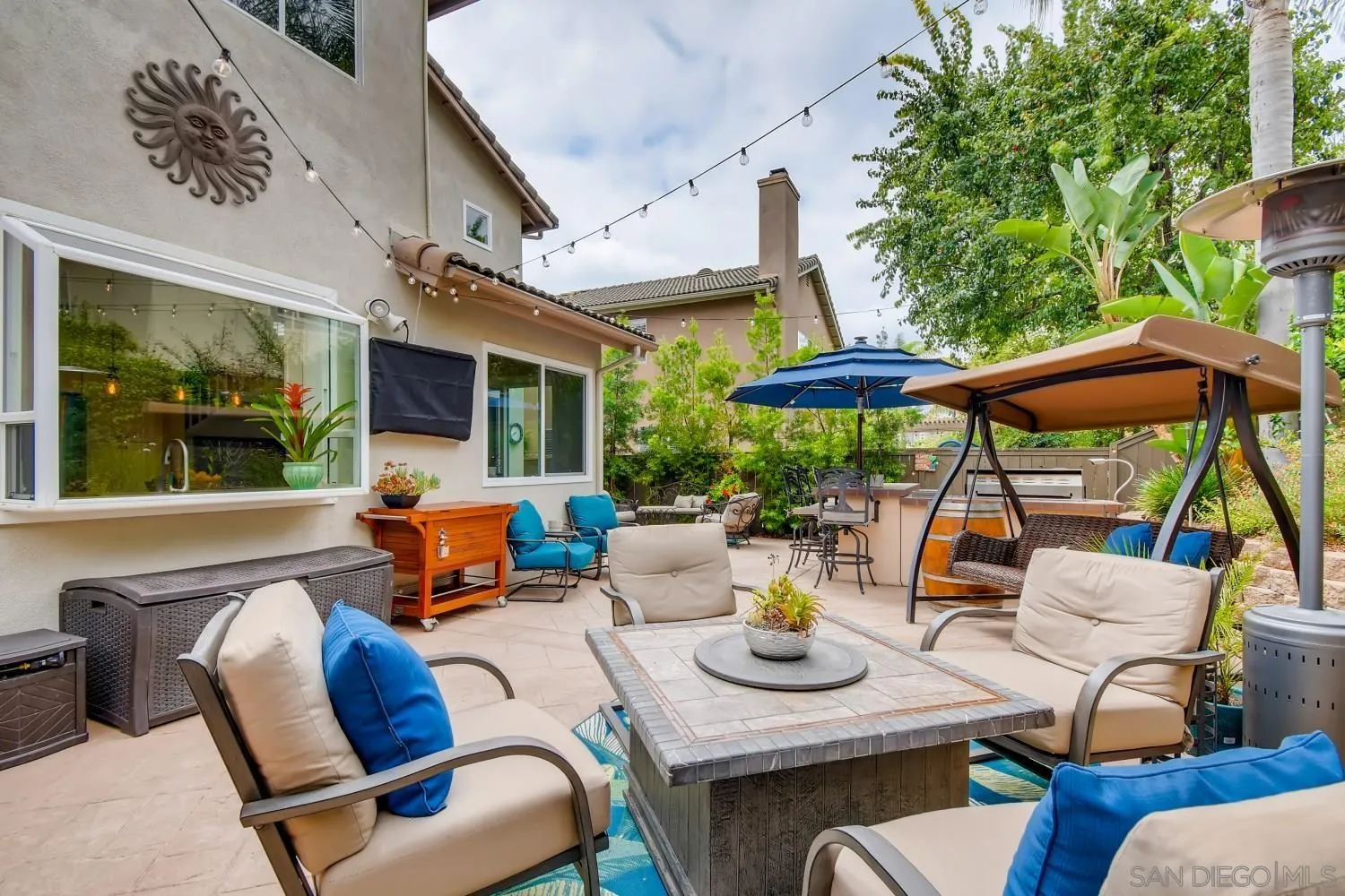 11468 Village Ridge Road San Diego, CA 92131 - Photo 25 of 28 a outdoor space with patio the couches and a potted plant