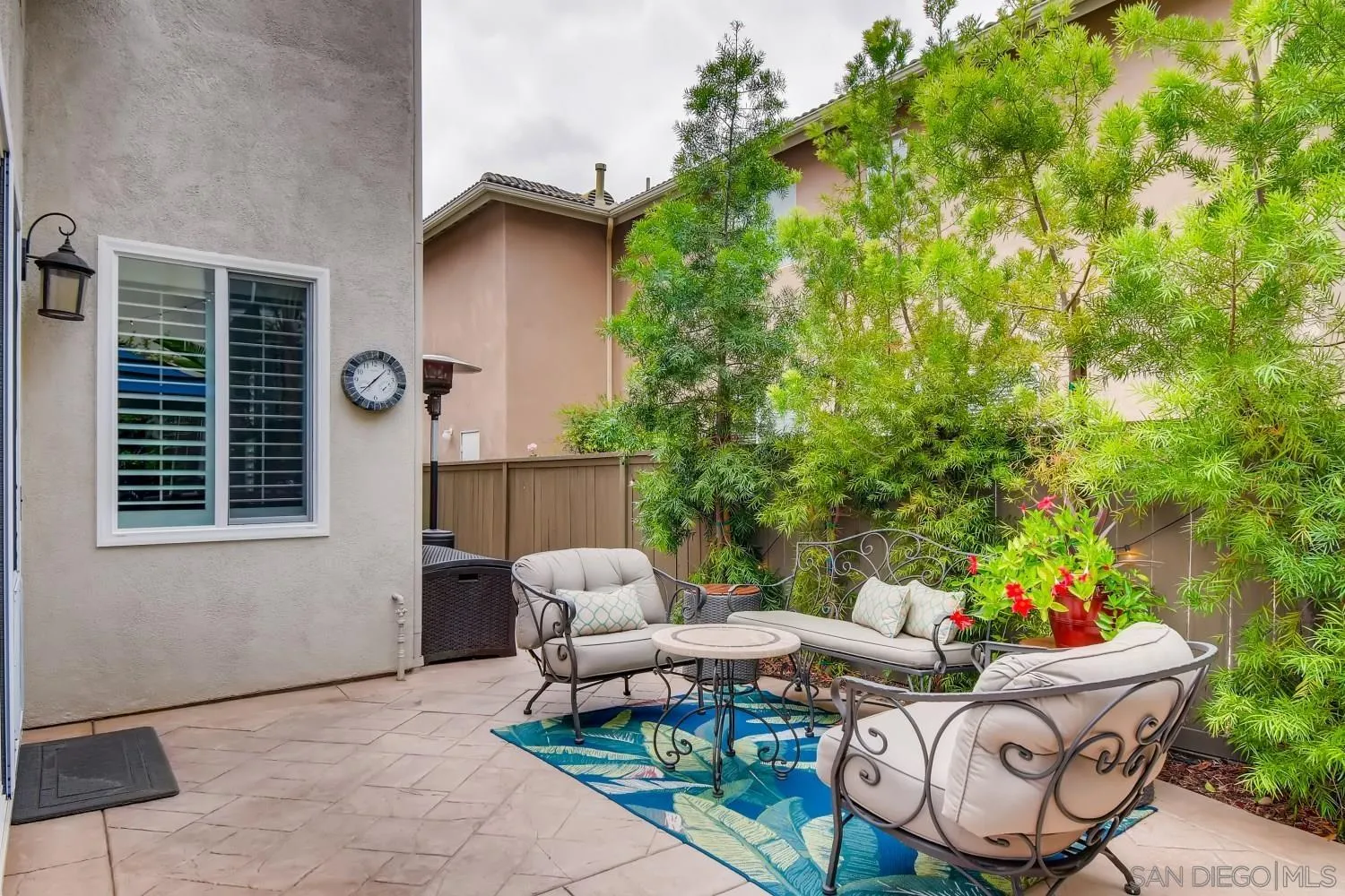 11468 Village Ridge Road San Diego, CA 92131 - Photo 28 of 28 a backyard of a house with table and chairs