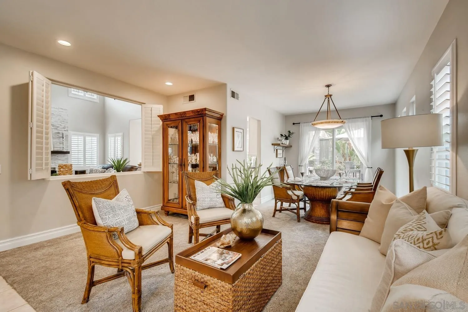 11468 Village Ridge Road San Diego, CA 92131 - Photo 4 of 28 a living room with furniture and a chandelier