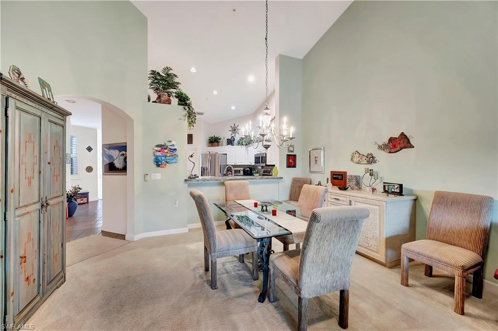 3055 Horizon Lane, Unit 1706 Naples, FL 34109 - Photo 14 of 42 a dining room with furniture and window
