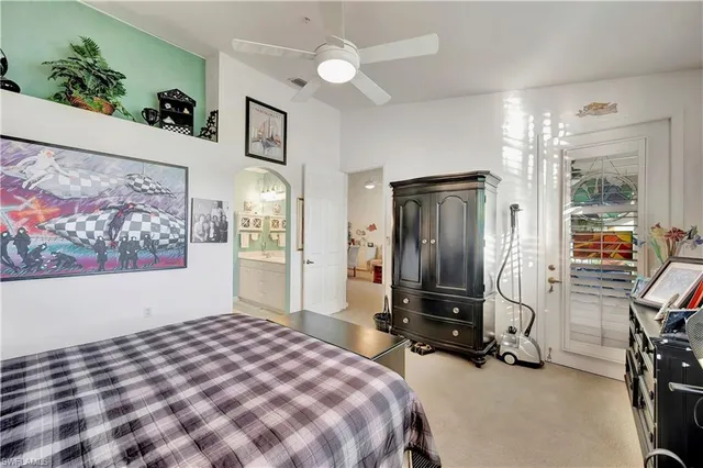 a spacious bathroom with a granite countertop sink and a mirror