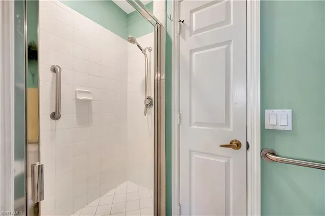 a bedroom with a bed and a chair