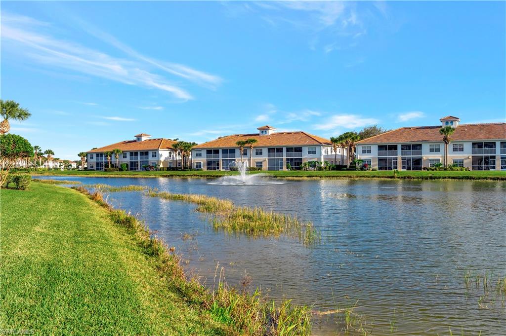 3055 Horizon Lane, Unit 1706 Naples, FL 34109 - Photo 30 of 42 a view of a lake with a city