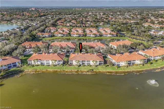 a aerial view of a house with a lake view