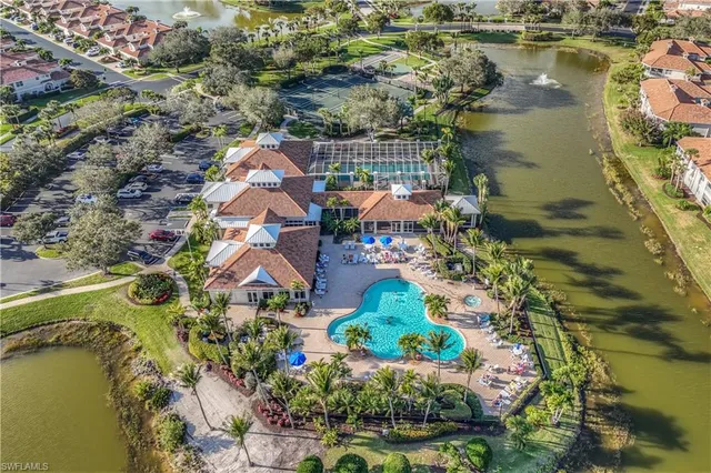an aerial view of a house with a lake view