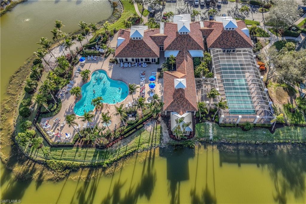 3055 Horizon Lane, Unit 1706 Naples, FL 34109 - Photo 40 of 42 an aerial view of a house with a lake view