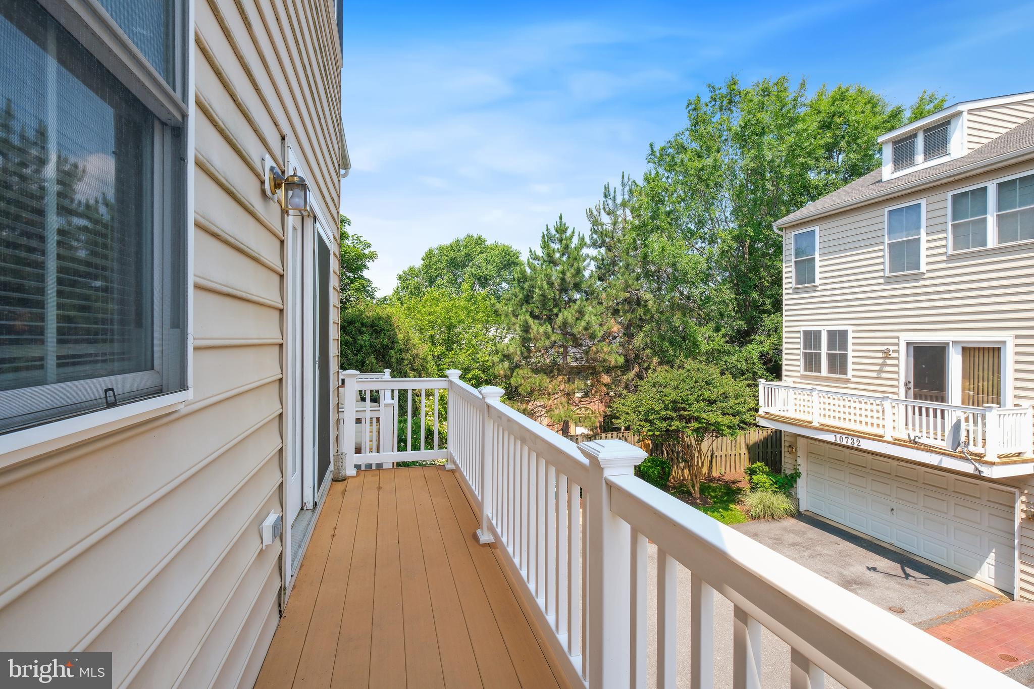 10728 Horde Street Silver Spring, MD 20902 - Photo 11 of 38 a view of balcony with wooden floor and fence