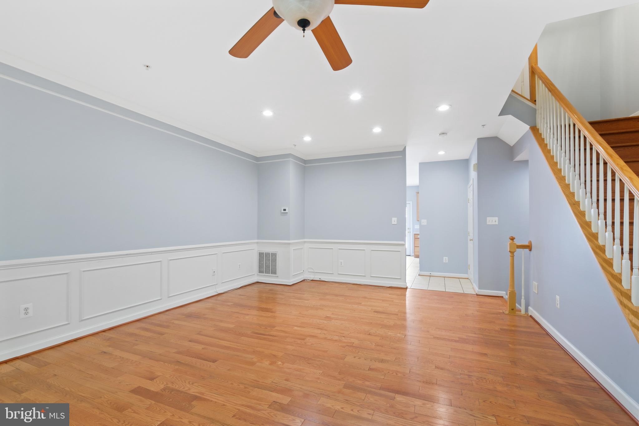 10728 Horde Street Silver Spring, MD 20902 - Photo 17 of 38 a view of an empty room with wooden floor