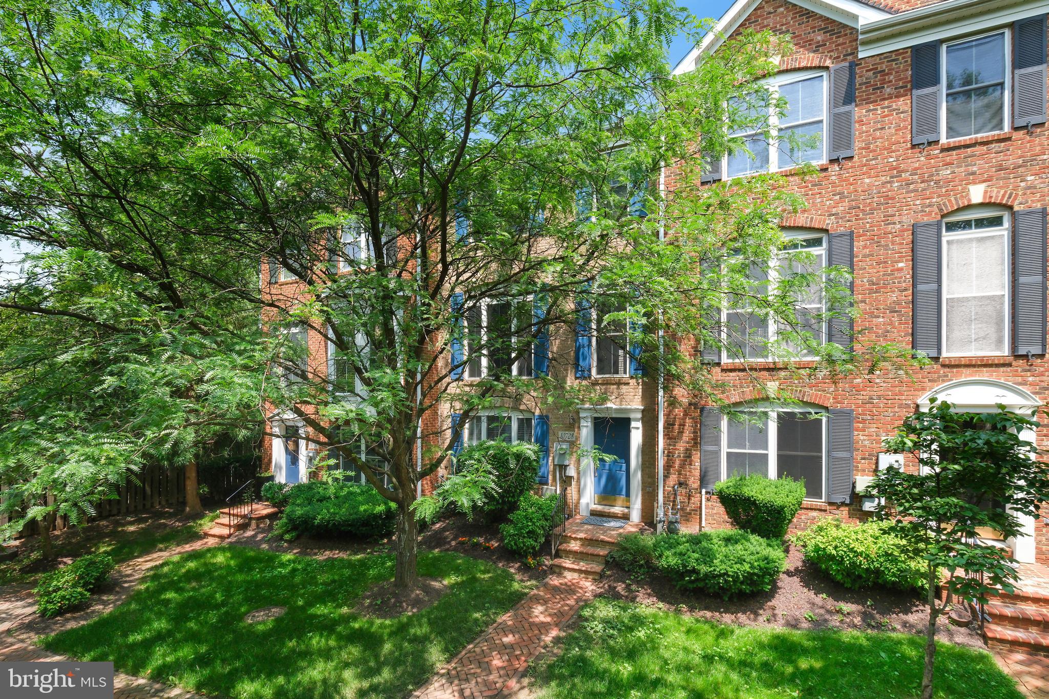 10728 Horde Street Silver Spring, MD 20902 - Photo 2 of 38 front view of a brick house with a yard
