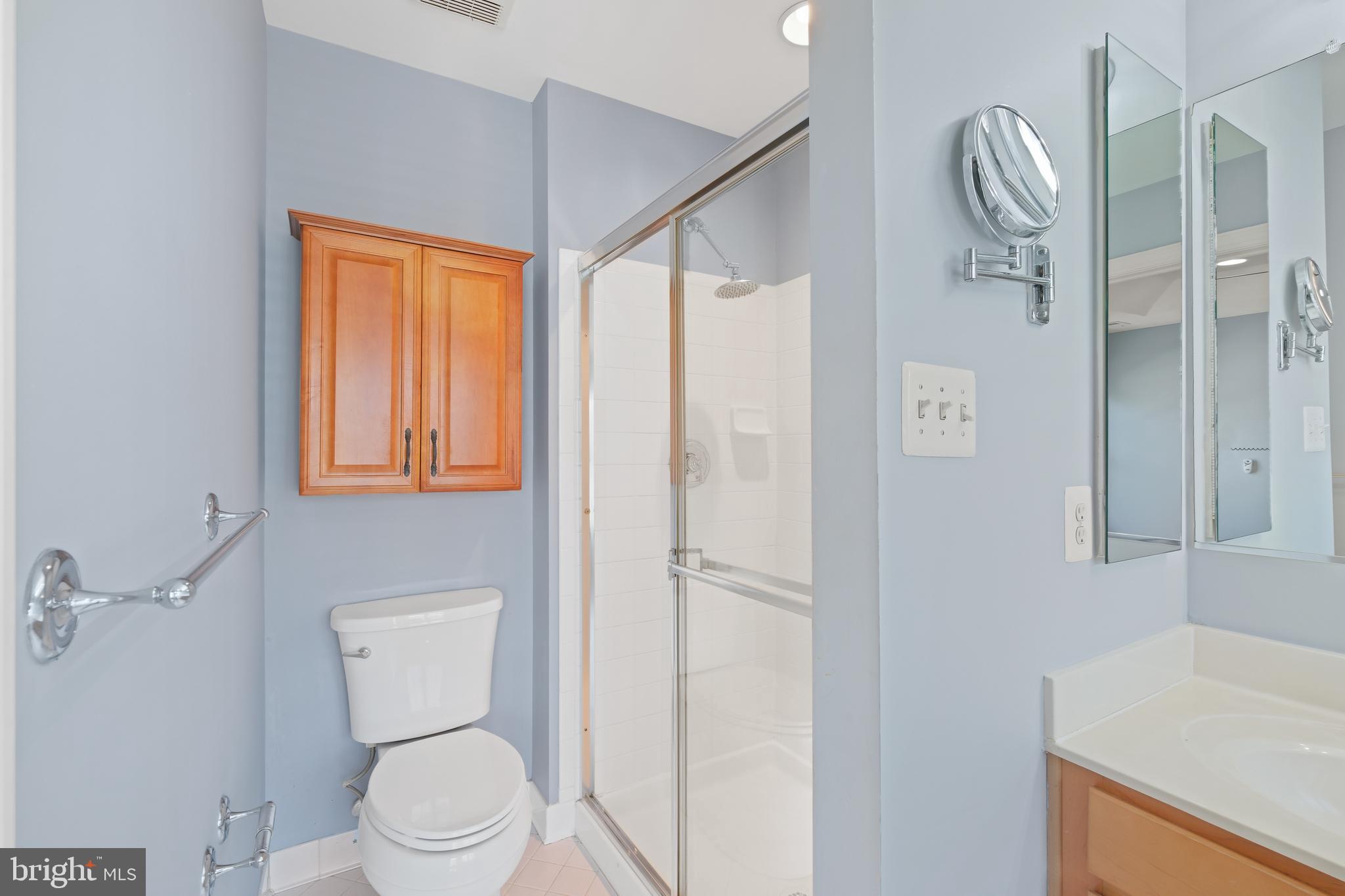 10728 Horde Street Silver Spring, MD 20902 - Photo 22 of 38 a bathroom with a toilet a sink and shower