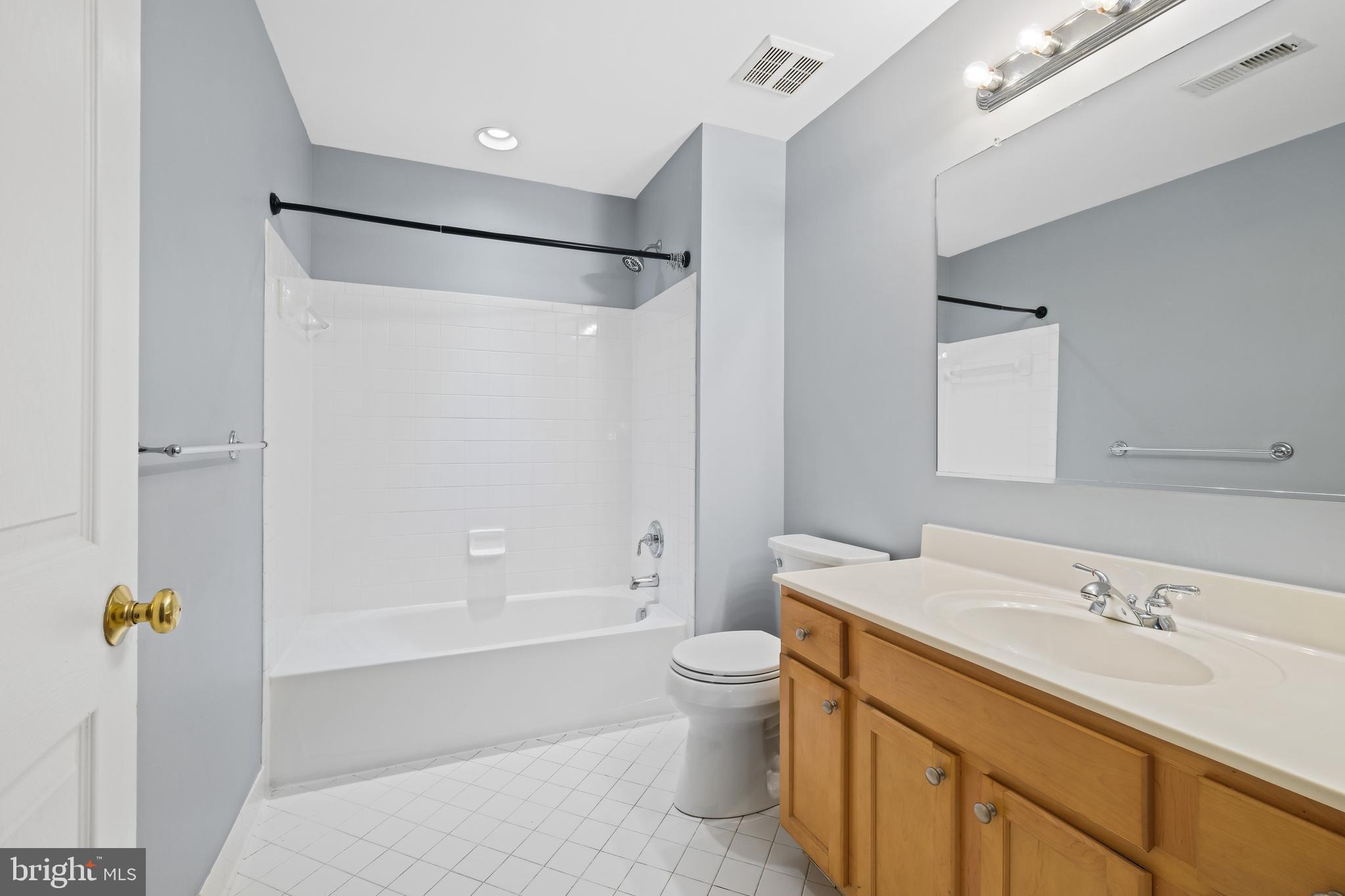 10728 Horde Street Silver Spring, MD 20902 - Photo 26 of 38 a bathroom with a sink toilet and shower