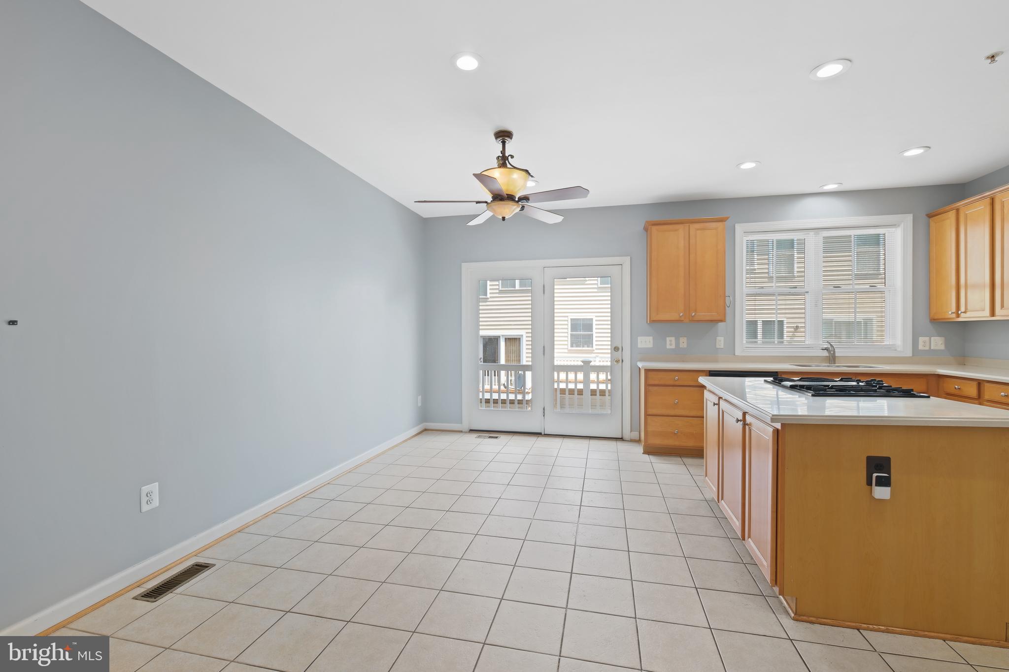 10728 Horde Street Silver Spring, MD 20902 - Photo 4 of 38 a kitchen with granite countertop a stove a sink dishwasher and a refrigerator
