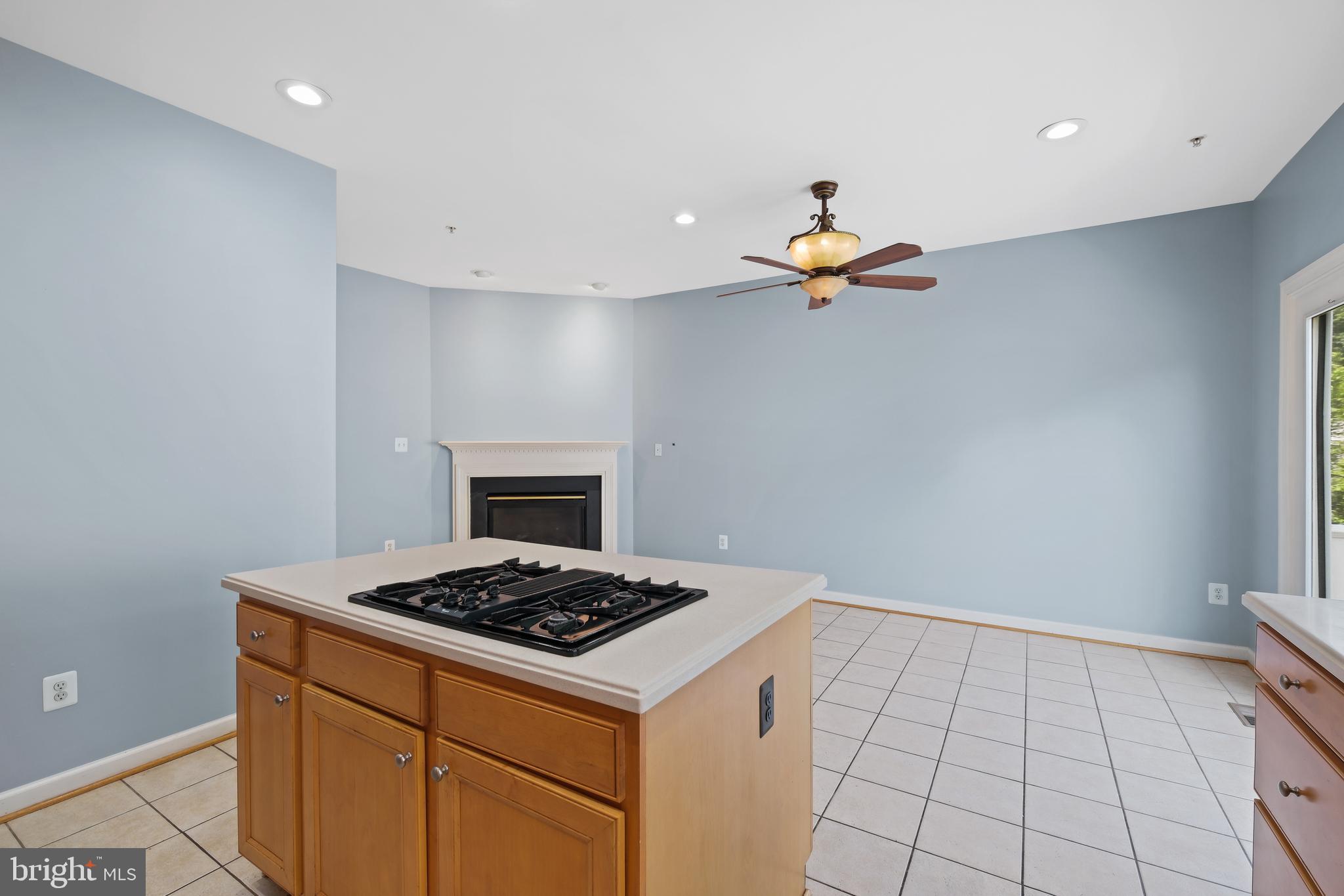 10728 Horde Street Silver Spring, MD 20902 - Photo 9 of 38 a kitchen with a stove cabinets and a window