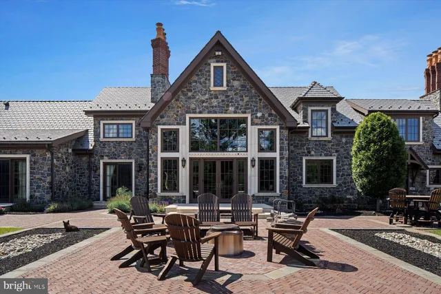 a view of walk in closet with clothes