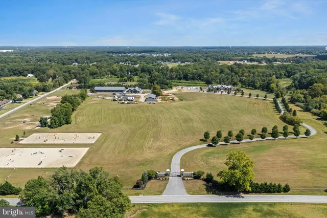 an aerial view of a residential building with outdoor space