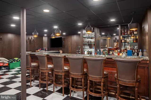 a view of a swimming pool with a yard and outdoor seating