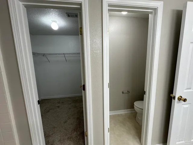 a view of a room with racks on the wall