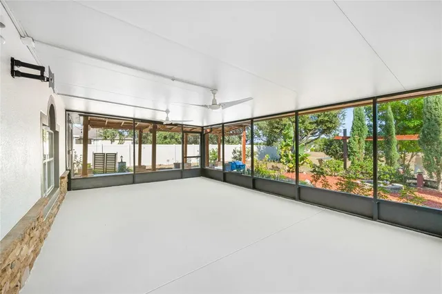 a view of an empty room with a large window