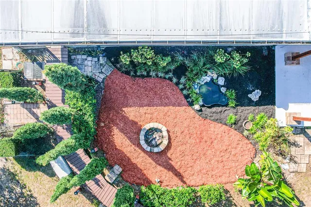 a aerial view of a house with balcony and garden