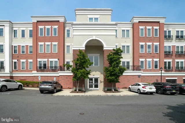 a couple of cars parked in front of a building
