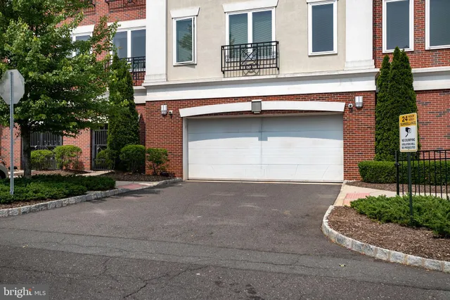 a view of a livingroom with furniture and cars
