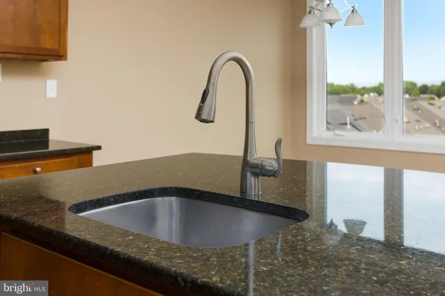 a kitchen with a sink and a window