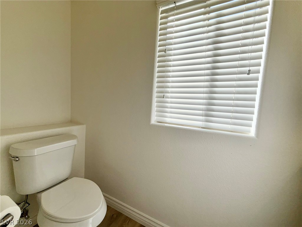 9729 Trail Rider Drive Las Vegas, NV 89117 - Photo 10 of 26 A well-lit, private water closet provides essential comfort and privacy.