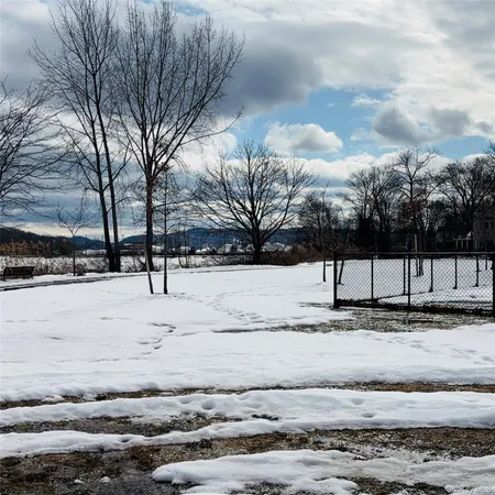 a view of yard covered with snow
