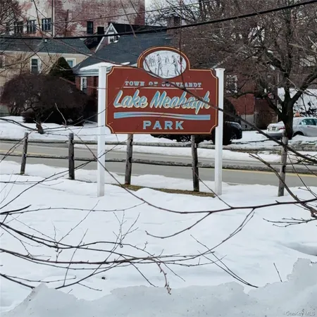 a sign on a street that has a sign on it