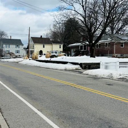 a view of street with parked cars