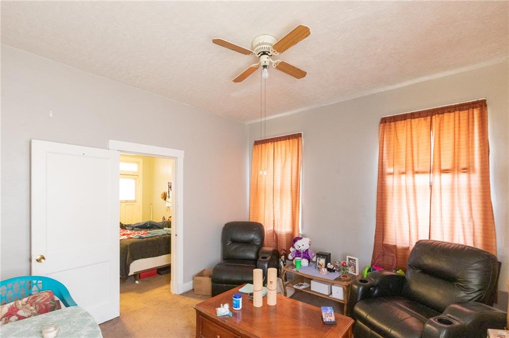 3 Alice Street McKees Rocks, PA 15136 - Photo 12 of 25 a living room with furniture and a window