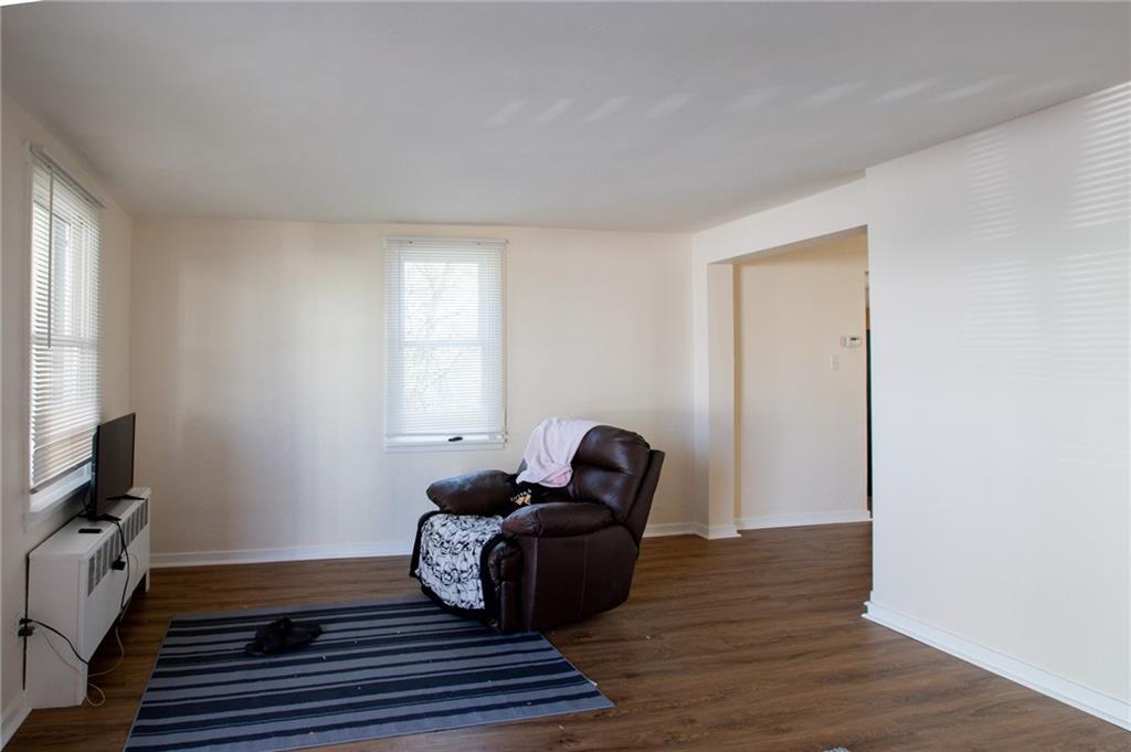 3 Alice Street McKees Rocks, PA 15136 - Photo 17 of 25 a living room with furniture and a window