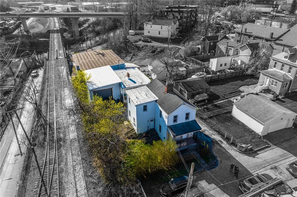 3 Alice Street McKees Rocks, PA 15136 - Photo 2 of 25 an aerial view of a house with a yard and lake view